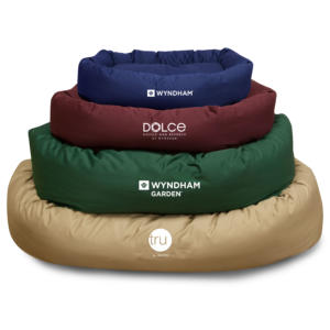 Amenity Services can customize dog beds with hotel logos.